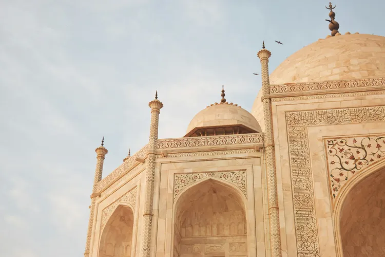 The pure white marble mausoleum of the Taj Mahal, Photo by Shalvi Raj on Unsplash